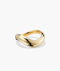 Sculptural gold-tone open-curve statement ring, angled view