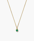 Fine gold-tone necklace with a round green stone pendant