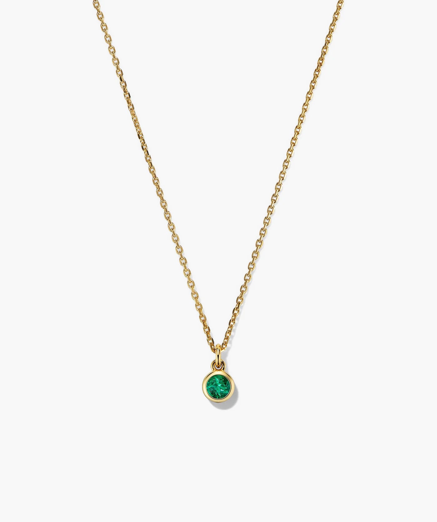 Fine gold-tone necklace with a round green stone pendant