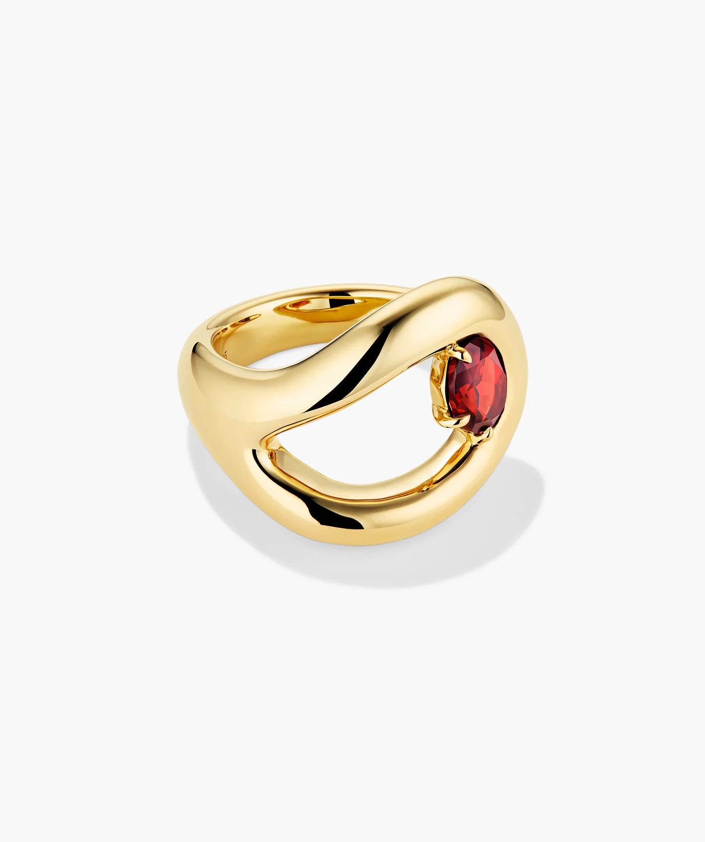 Gold-tone open curve ring set with a deep red oval stone