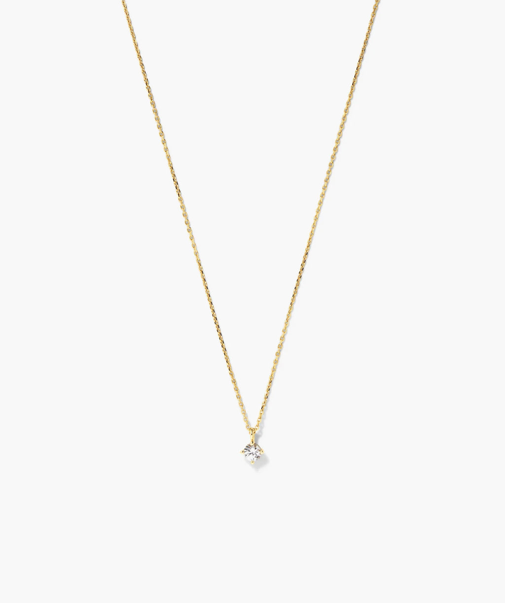 Fine gold-tone necklace with a round clear solitaire stone