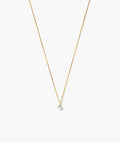 Fine gold-tone necklace with a round clear solitaire stone