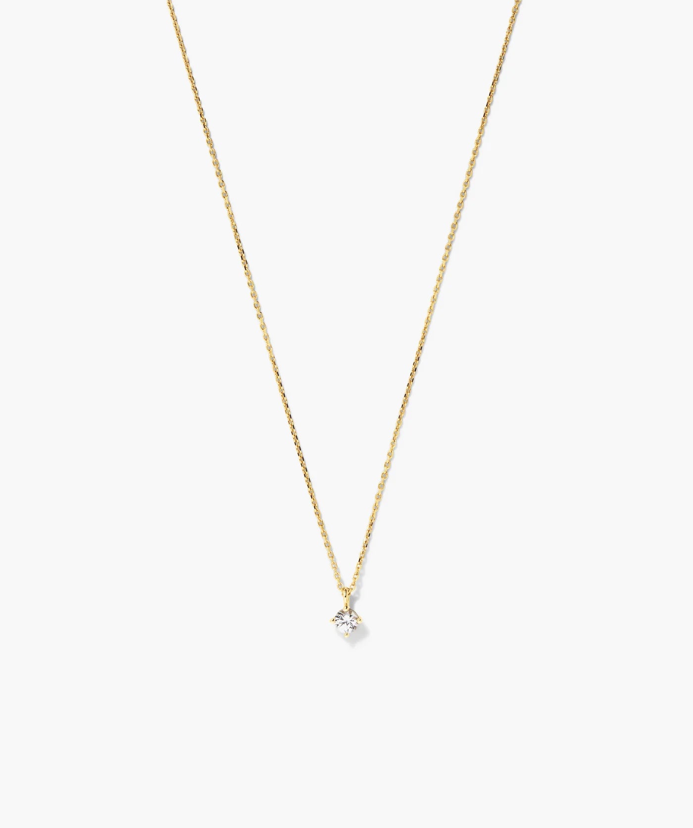 Fine gold-tone necklace with a round clear solitaire stone