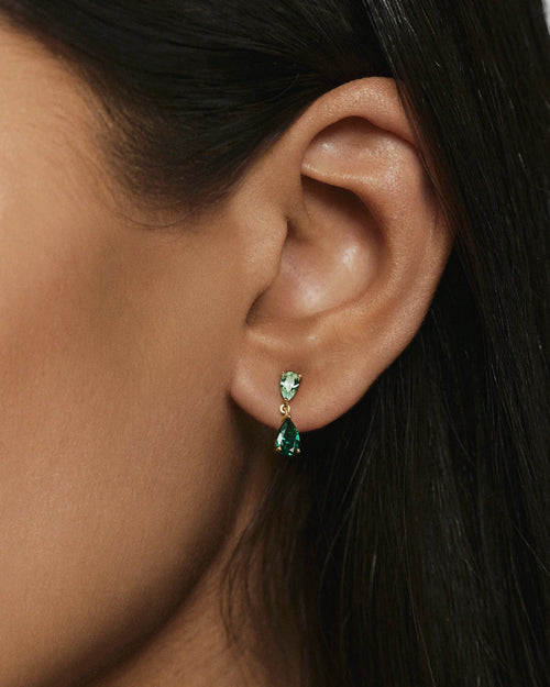Ada green stone drop earrings worn on the ear