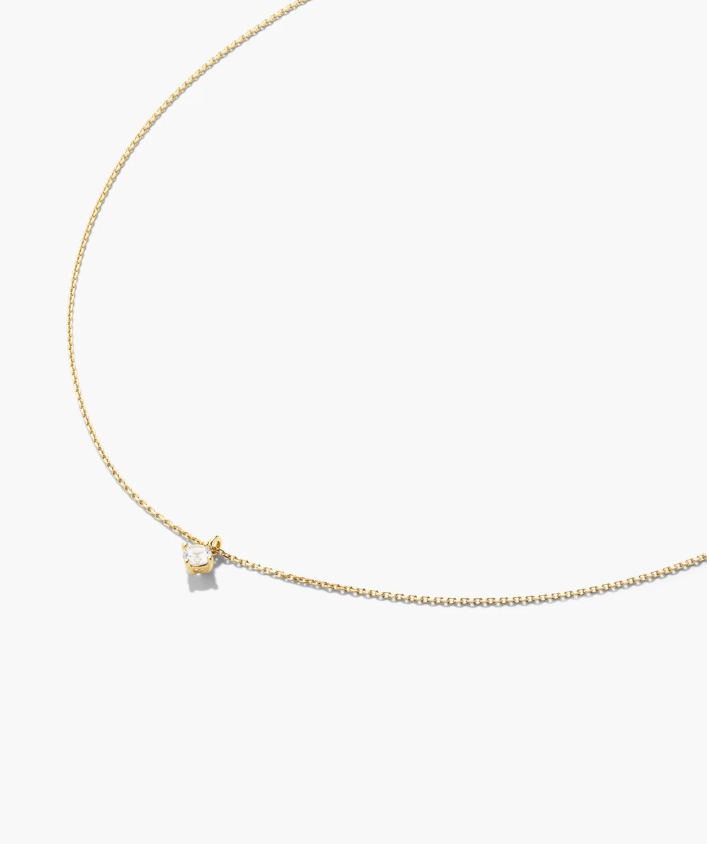Round solitaire pendant necklace laid flat
