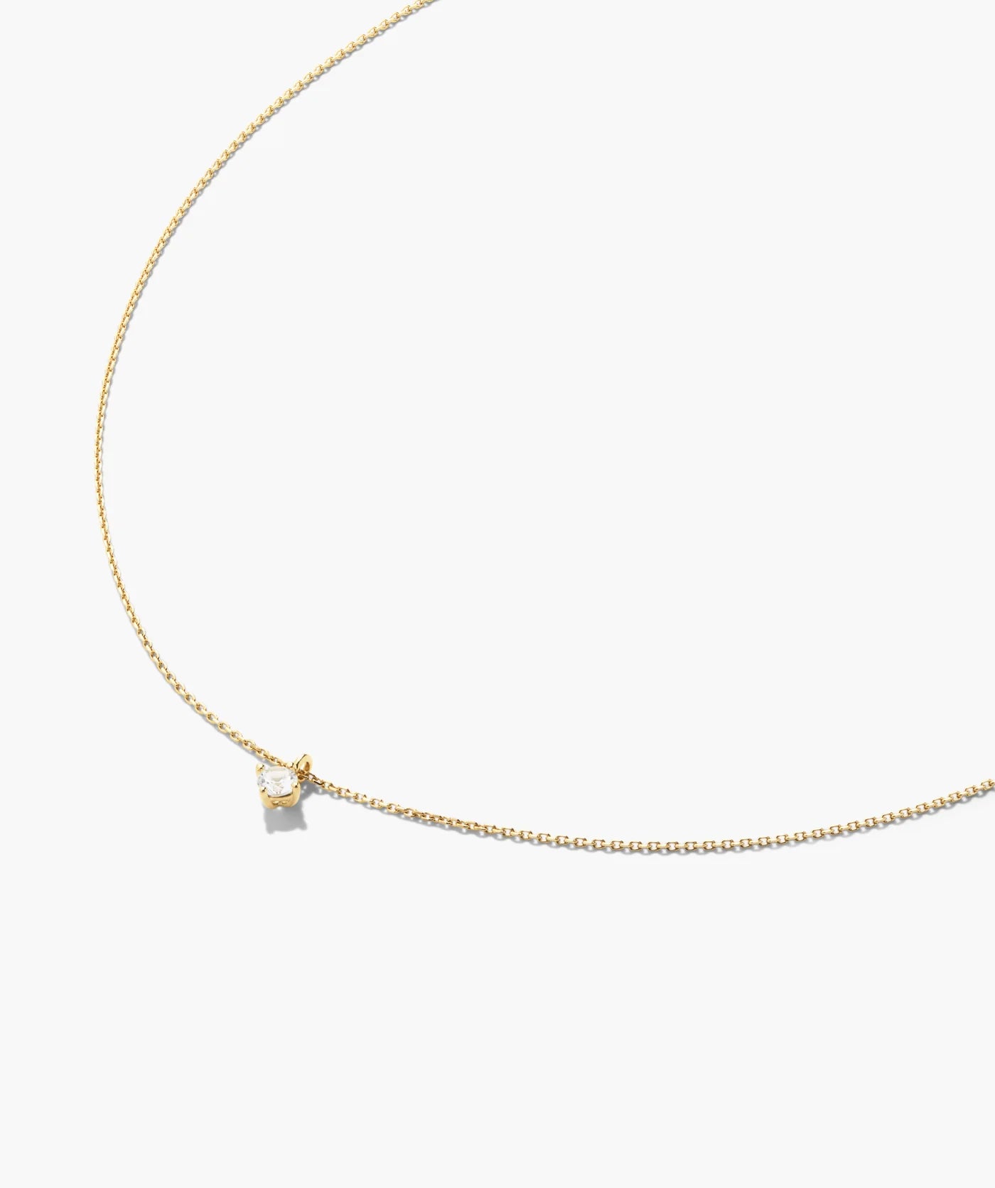 Round solitaire pendant necklace laid flat