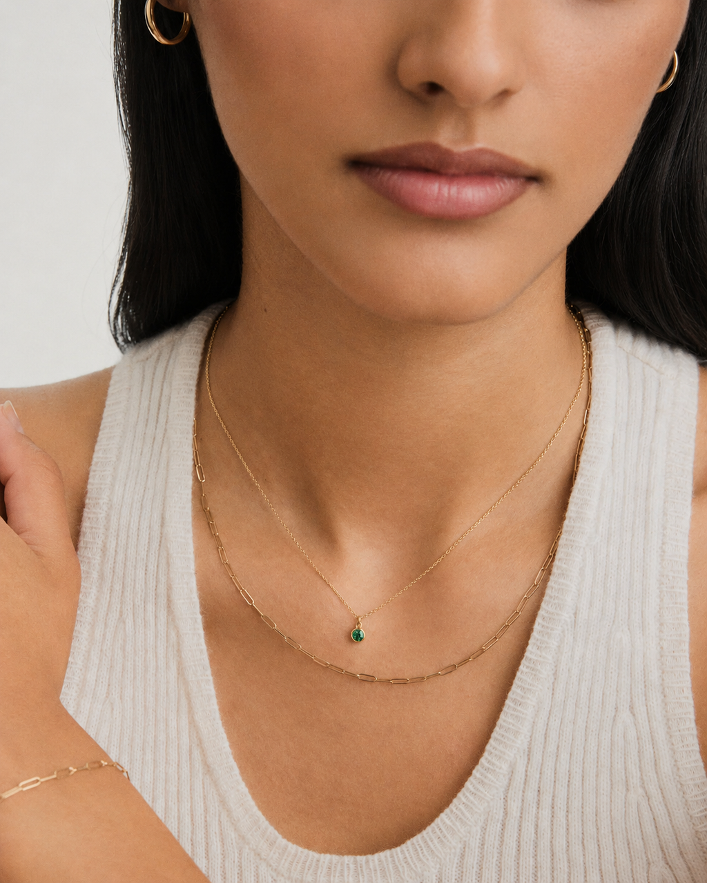 Sia green stone pendant necklace worn at the collarbone