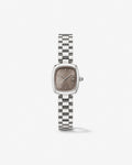 Small silver-tone cushion watch with a taupe dial on a link bracelet