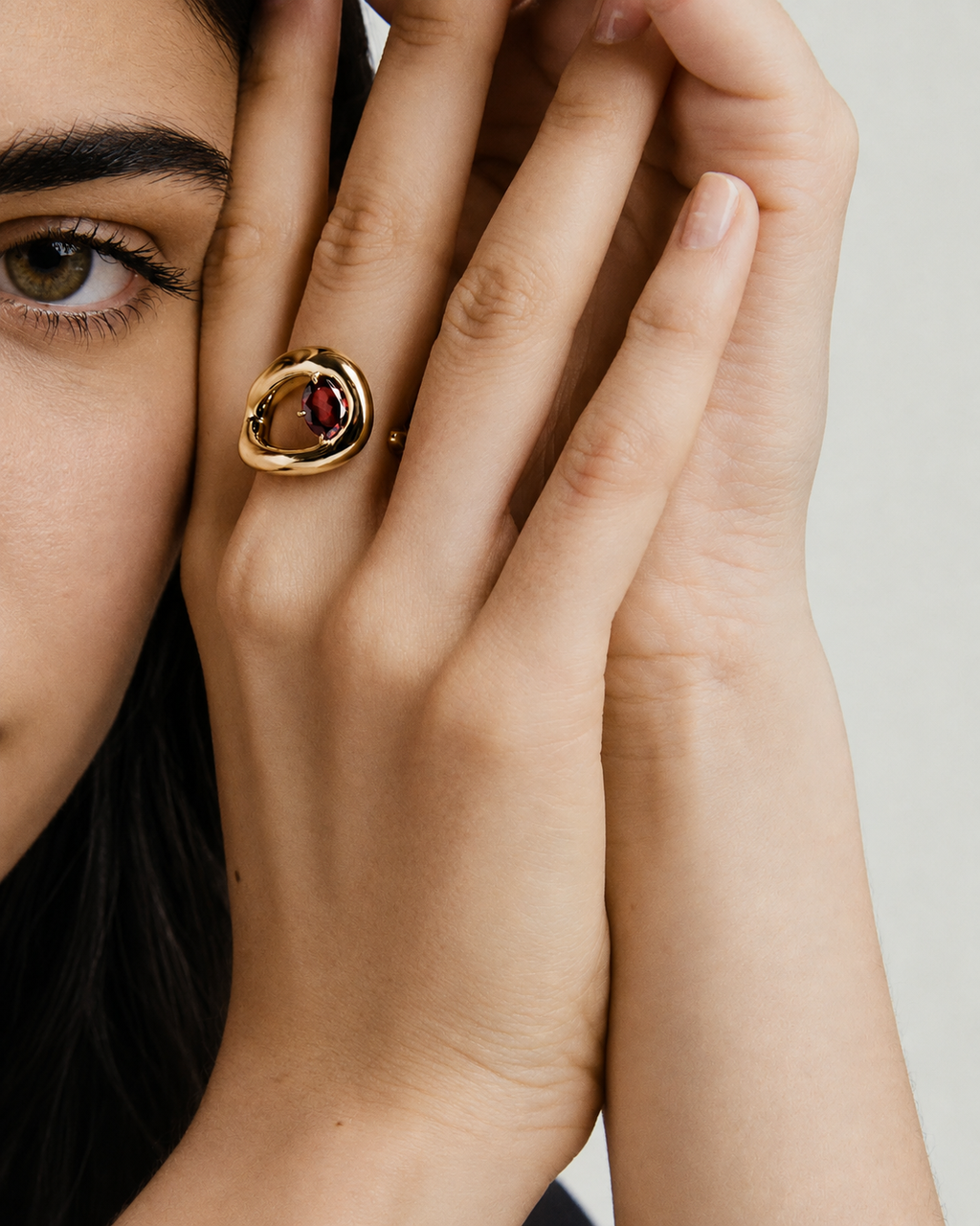 Organic Dôme Curve Ring in red worn on a hand